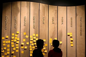 children looking at section of We Are Nature