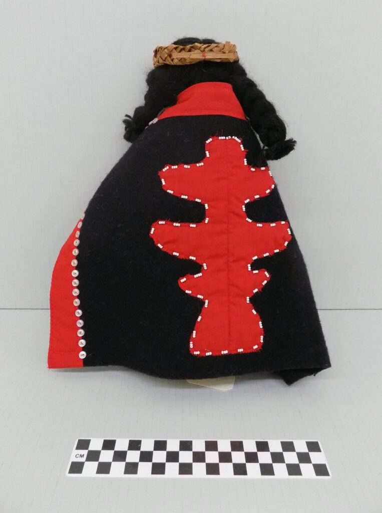 Kwakwa̱ka̱ʼwakw Woman doll back