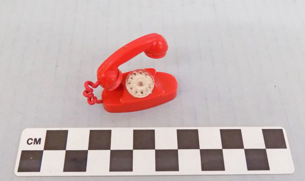 Barbie-sized red rotary telephone