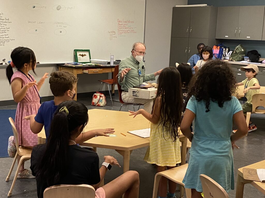 Pat McShea presenting to a group of kids in a classroom