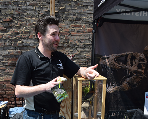 A museum educator shows off some specimens