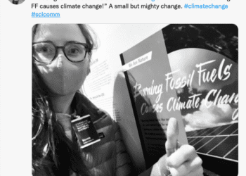 Tweet includes a selfie photo of the author in front of the new label. The tweet reads “That’s right—the fossil fuels exhibit @CarnegieMNH now states ‘Burning FF causes climate change’! A small but mighty change. #climatechange #scicomm” My twitter handle is @BonnSci and the museum is @CarnegieMNH.